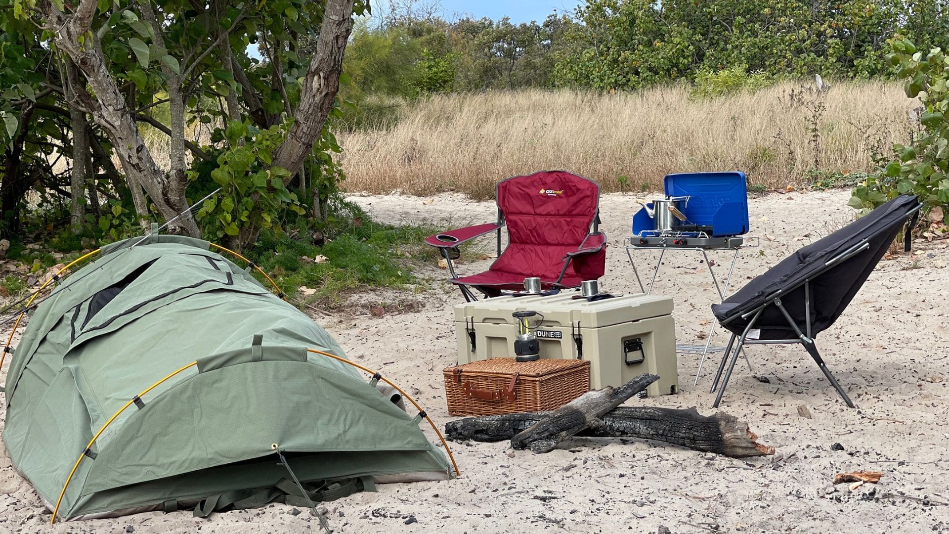 Single swag set up with a Spinifex stove, Oztrail Getaway Maroon Deluxe Chair & Dune Cooler Box